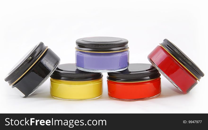 Five paint bottles of glass on a white background. Five paint bottles of glass on a white background