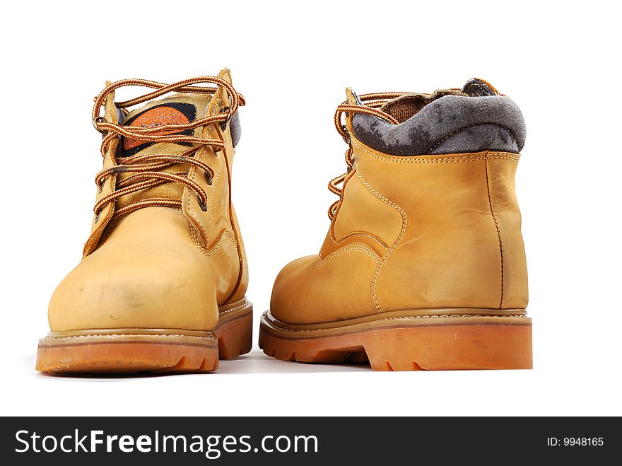 Yellow boots on a thick sole for heavy work and walks.