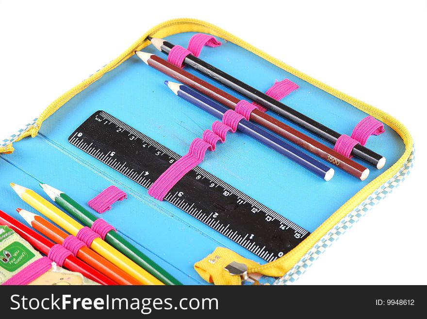 School case with a set of handles of pencils and a black ruler.