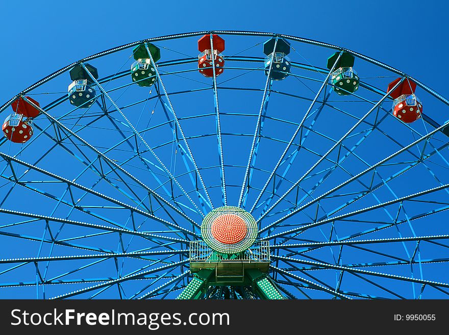 Colorful joy wheel in the blue sky