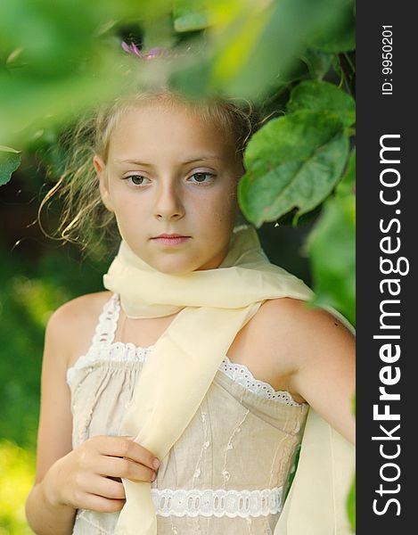 Portrait of the girl in a beautiful dress, on a  background solar wood. Portrait of the girl in a beautiful dress, on a  background solar wood