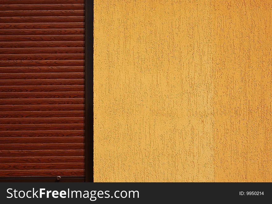 Yellow wall and brown window. abstract architecture shot. Yellow wall and brown window. abstract architecture shot