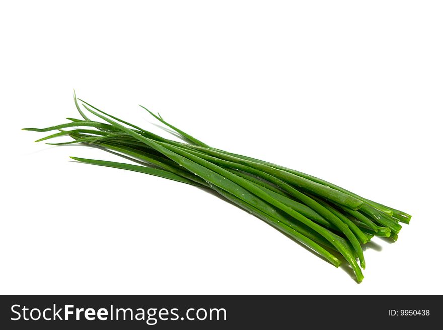 A bunch of green onions (sometimes called shallots or scallions), isolated on white.