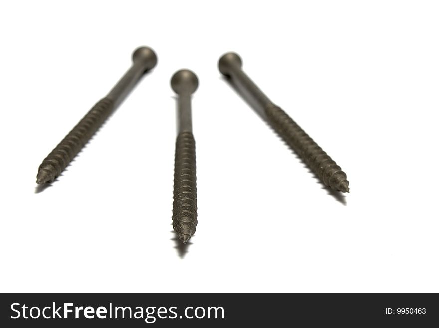Three metal screws isolated on white