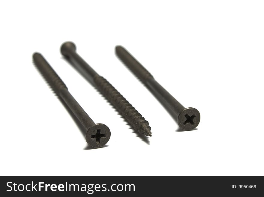 Three metal screws isolated on white