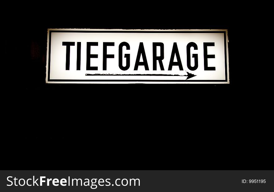 An old sign with the words Tiefgarage German for underground parking garage. An old sign with the words Tiefgarage German for underground parking garage