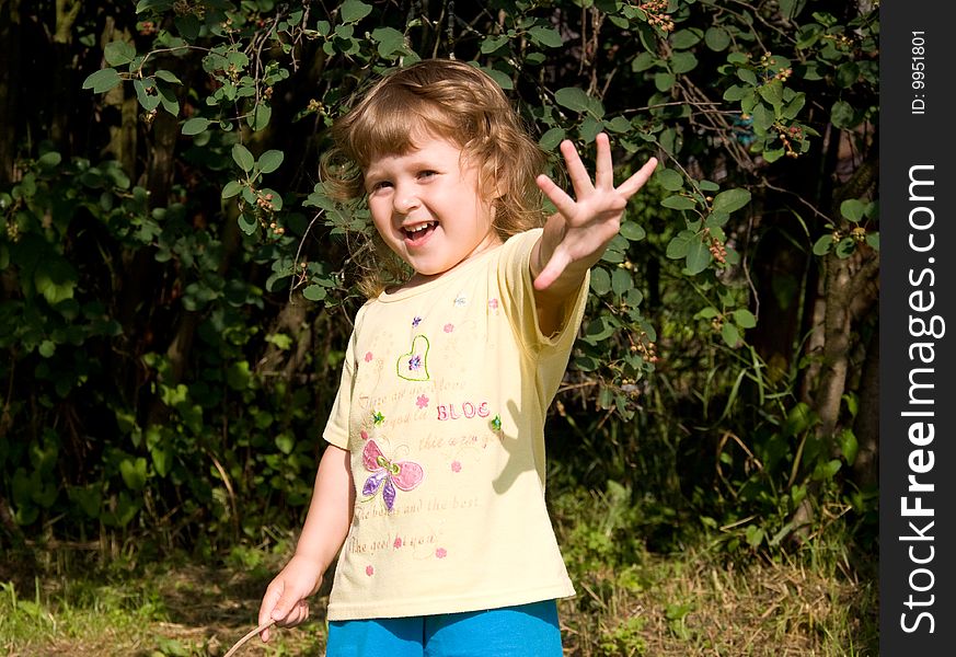 Smiling little girl in the garden. Smiling little girl in the garden