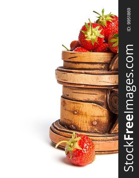Wooden mug with a fresh strawberry (right)