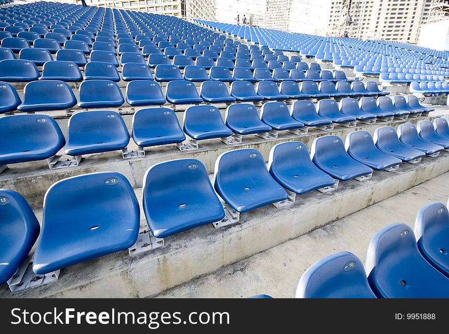 Blue sector seating gallery in a local stadium. Blue sector seating gallery in a local stadium.