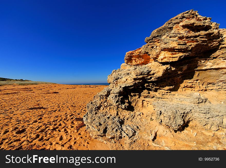 Beautiful beach with footprints and large rocks. Beautiful beach with footprints and large rocks