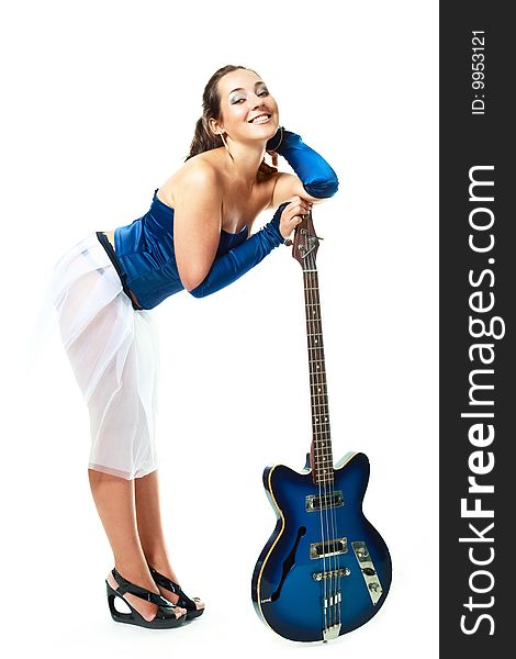 young brunette woman with a guitar against white background. young brunette woman with a guitar against white background