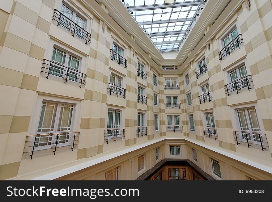 Interior of a luxury hotel with glass ceiling. Interior of a luxury hotel with glass ceiling