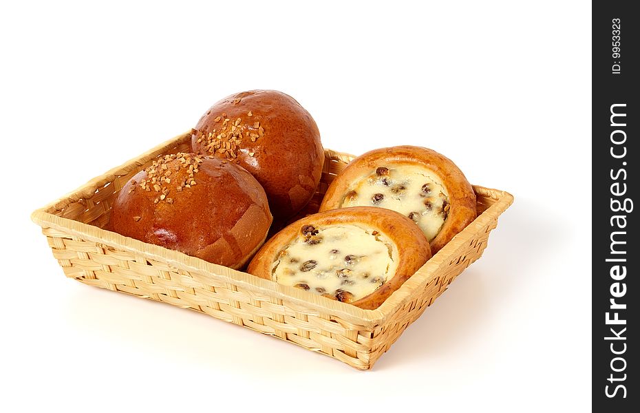 There are different types of pastry in the basket. Isolated on white background. There are different types of pastry in the basket. Isolated on white background.