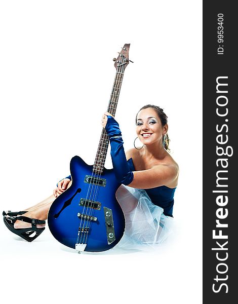 Sexy young brunette woman with a guitar against white background. Sexy young brunette woman with a guitar against white background