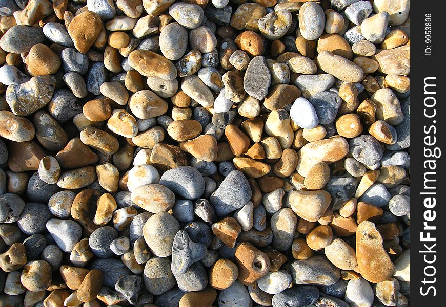 Beach pebbles in the sunlight on hastings beach uk. Beach pebbles in the sunlight on hastings beach uk