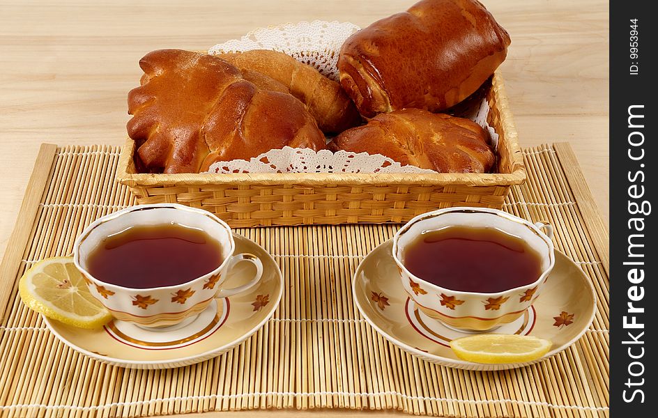 Tea with lemon and pastry.