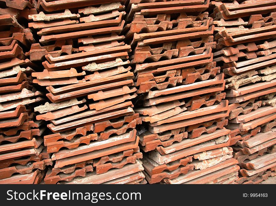 Old red roof tiles ready to be re-used. Old red roof tiles ready to be re-used