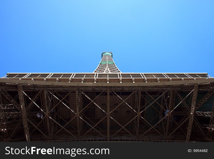 The Eiffel Tower, Paris, France, in horizotal orientation, with a clear, blue sky background