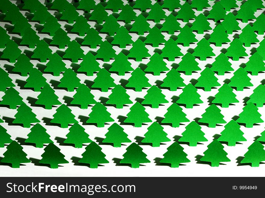 Green paper trees against white background