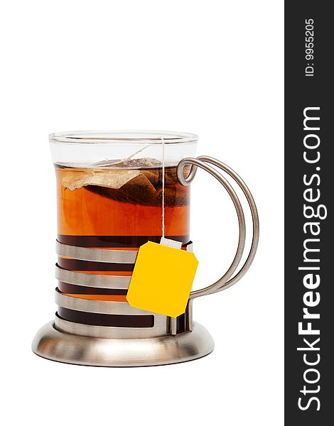 Tea in a glass with a cup holder on a white background
