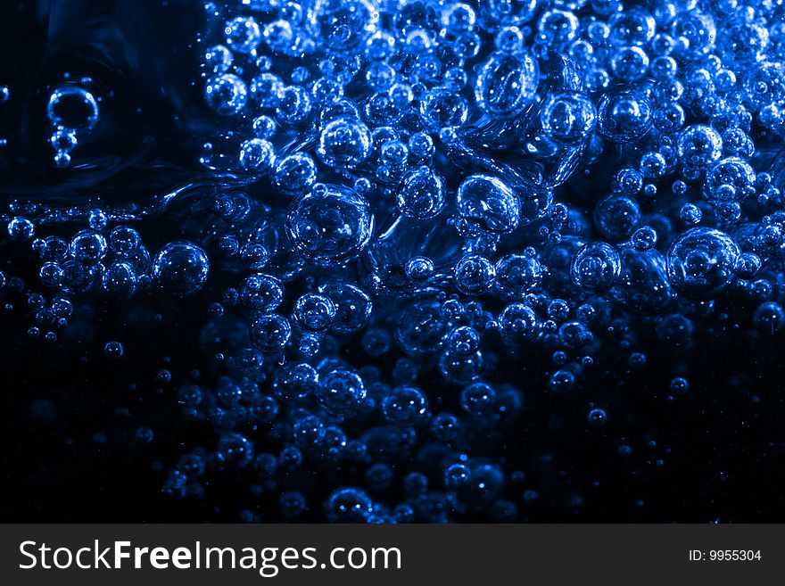 Macro of blue air bubbles underwater. Macro of blue air bubbles underwater