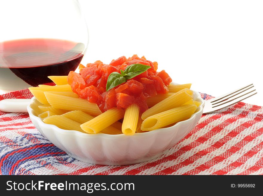 Fresh penne pasta with tomato and basil sauce. Fresh penne pasta with tomato and basil sauce.