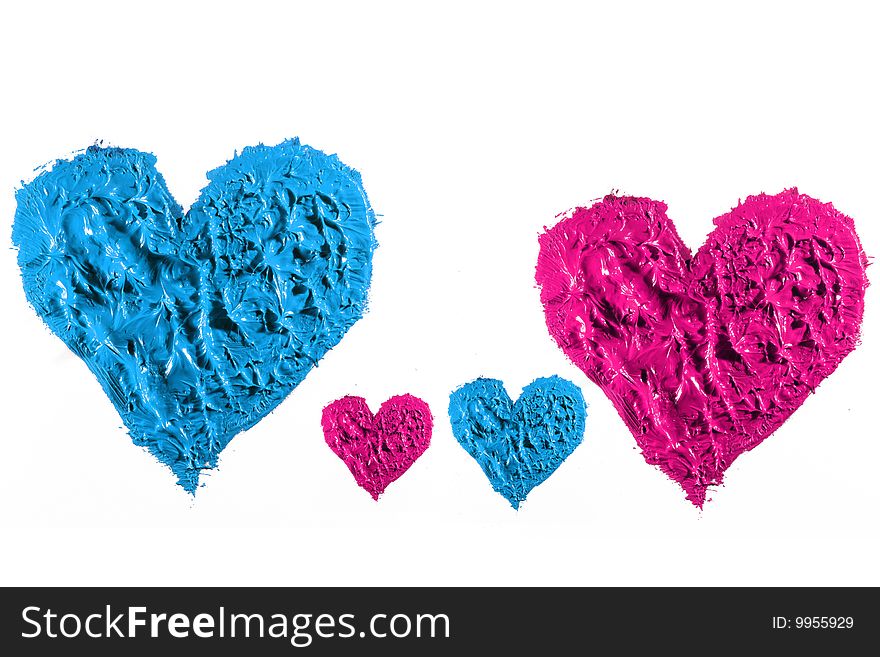 Blue and pink oil paint  making heart isolated. Blue and pink oil paint  making heart isolated