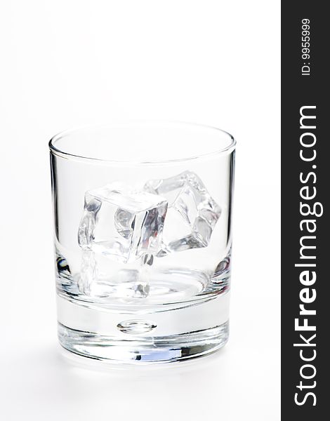 Alcoholic beverage whith ice cubes isolated over white