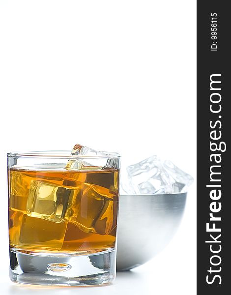 Alcoholic beverage whith ice cubes isolated over white
