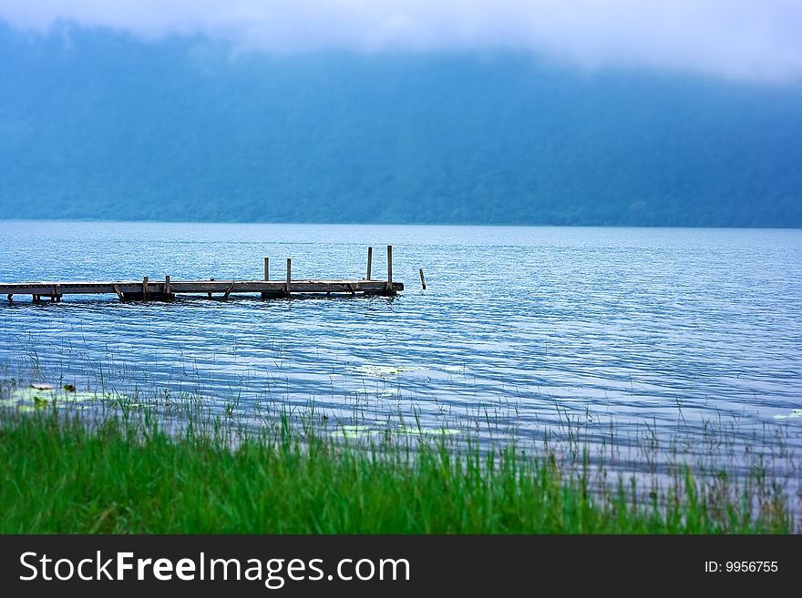 Lonely wood pier on Bratang lake in Indonesia. Lonely wood pier on Bratang lake in Indonesia