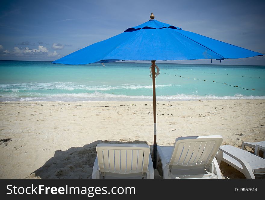 Lounge chairs at the beach in Cancun