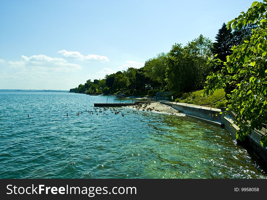 Shoreline along Lake Ontario on a beautiful day in June. Shoreline along Lake Ontario on a beautiful day in June.