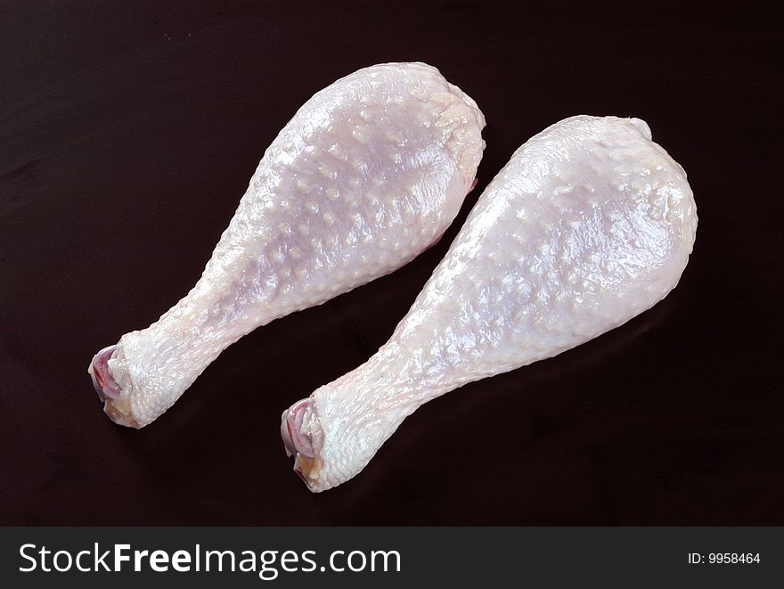 Two Chicken Legs on Black Background. Two Chicken Legs on Black Background