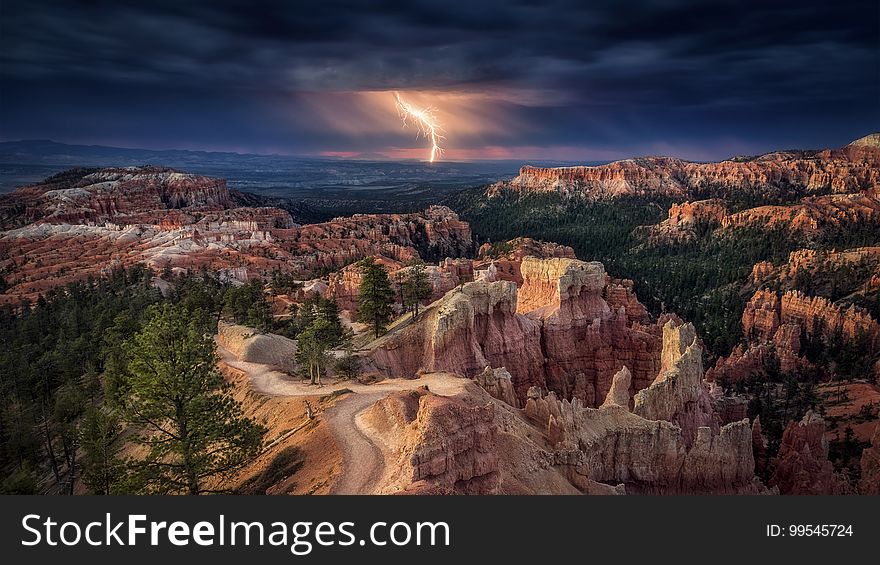 A lightning bolt strikes over a canyon. A lightning bolt strikes over a canyon.