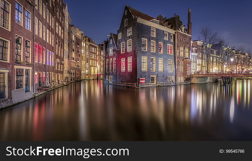 There are parts of Amsterdam that looks like you are in Venice. This scene of Amsterdam gives you a view behind the houses of the Red Light District. On the left you can see some of the red light coming out of the windows, reflecting on the house on the other side. [ Facebook ] [ Google+ ] [ Website ]. There are parts of Amsterdam that looks like you are in Venice. This scene of Amsterdam gives you a view behind the houses of the Red Light District. On the left you can see some of the red light coming out of the windows, reflecting on the house on the other side. [ Facebook ] [ Google+ ] [ Website ]