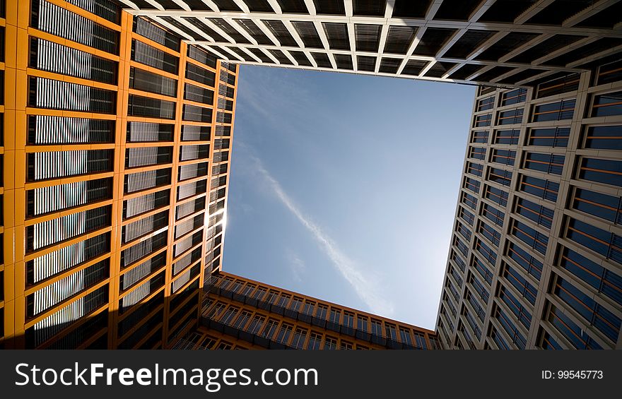 Exterior of contemporary architecture with open blue skies on sunny day. Exterior of contemporary architecture with open blue skies on sunny day.