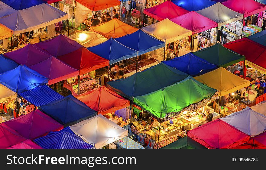 Colorful canopies over stalls in outdoor market at night. Colorful canopies over stalls in outdoor market at night.