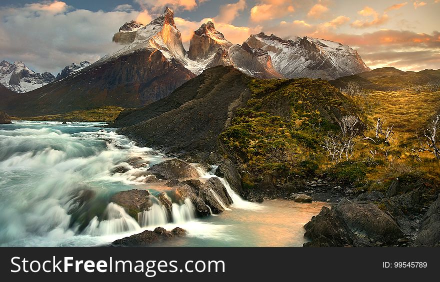 Waterfalls in valley of mountain landscape at sunset. Waterfalls in valley of mountain landscape at sunset.
