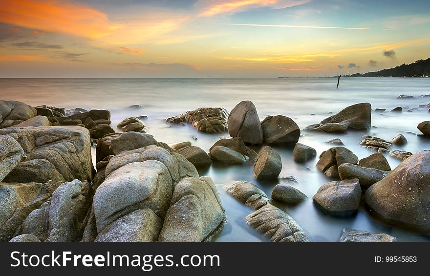 Rocks on a beach at dusk. Rocks on a beach at dusk.