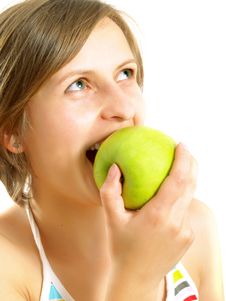 Biting A Fresh Green Apple Royalty Free Stock Images