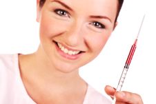 Smiling Nurse Holding Up Syringe Of Blood Royalty Free Stock Images Smiling Nurse Holding Up Syringe Of Blood Royalty Free Stock Images