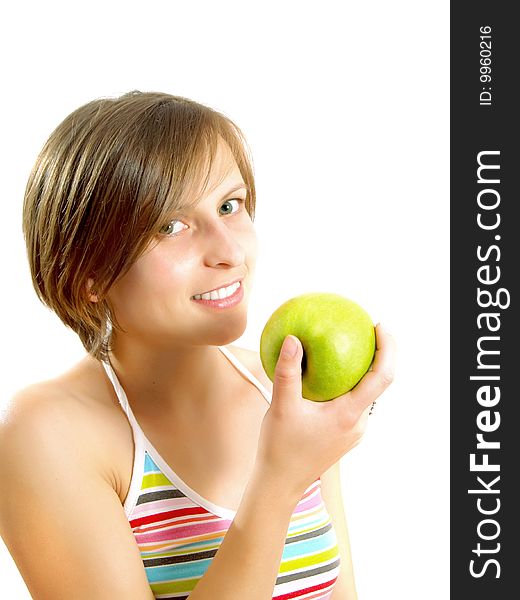 Portrait of a pretty Caucasian blond girl with a nice colorful striped dress who is smiling and she is holding a green apple in her hand. Isolated on white. Portrait of a pretty Caucasian blond girl with a nice colorful striped dress who is smiling and she is holding a green apple in her hand. Isolated on white.