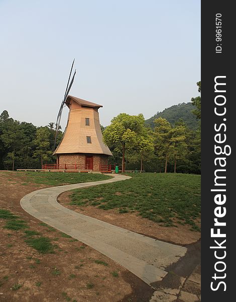 A windmill in Prince Bay Park on the shores of Hangzhou's famous West Lake. 
. A windmill in Prince Bay Park on the shores of Hangzhou's famous West Lake.