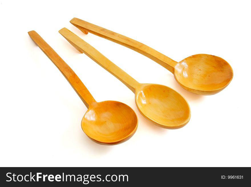 Three wooden spoons isolated on white background