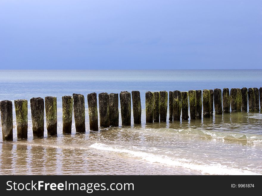 Breakwater in the Sea and blue sky