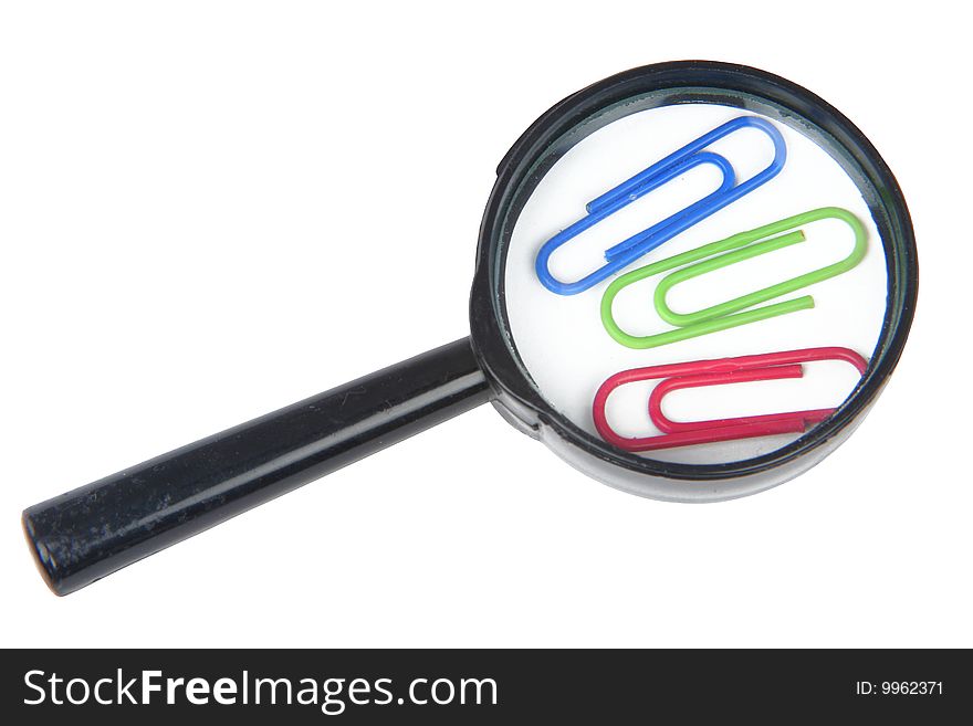 Magnifier and three paper clips on a white background