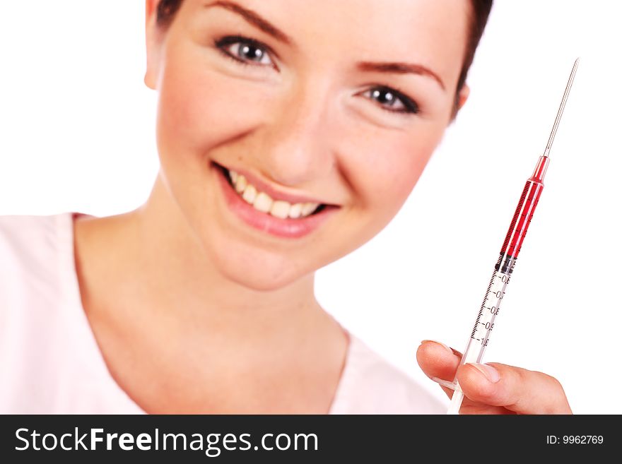 Smiling nurse holding up syringe of blood