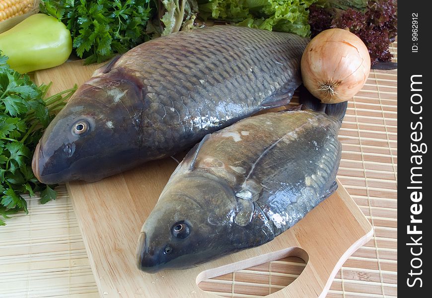 Carp fish close-up on chopping board