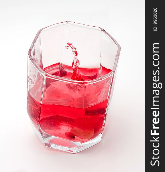 Red drink in a transparent glass. Red drink in a transparent glass