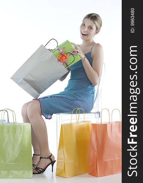 Portrait of an attractive young woman holding several shoppingbags.